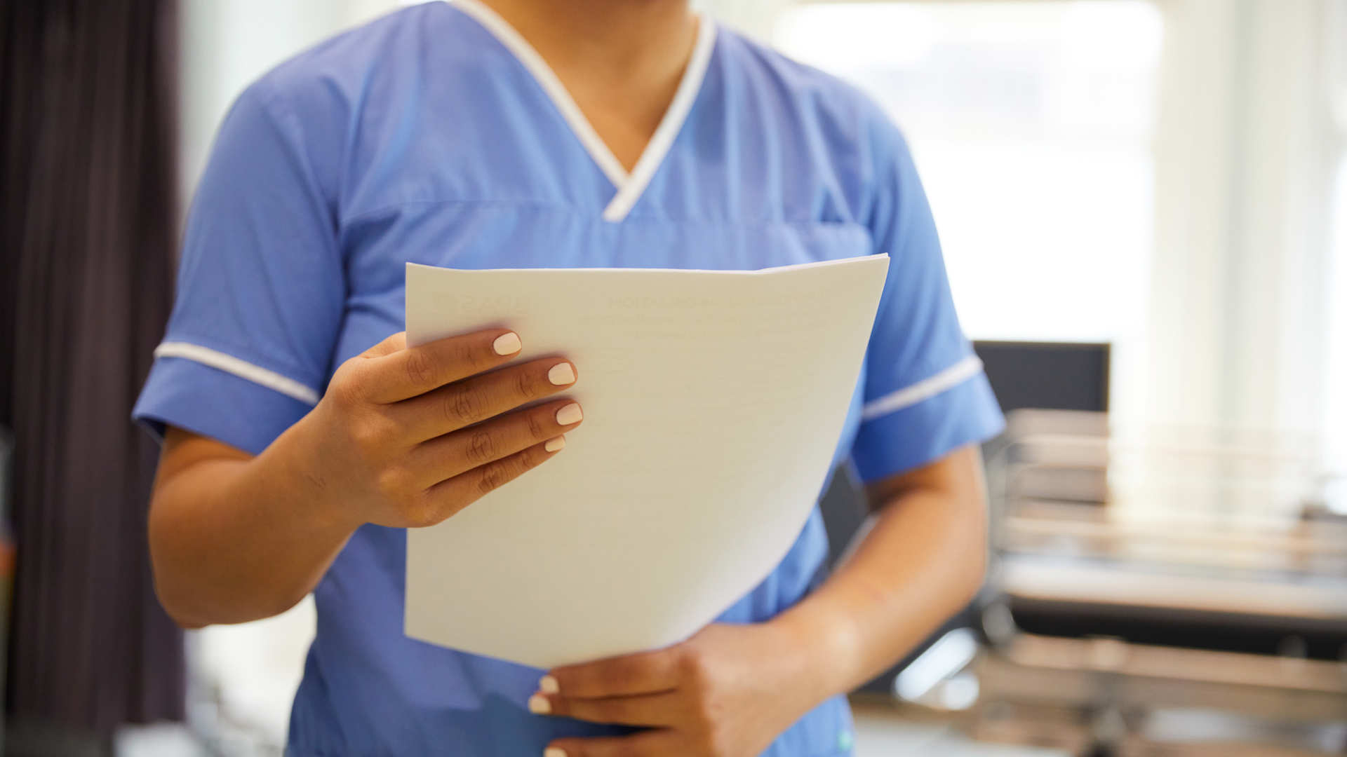 Nurse with documents