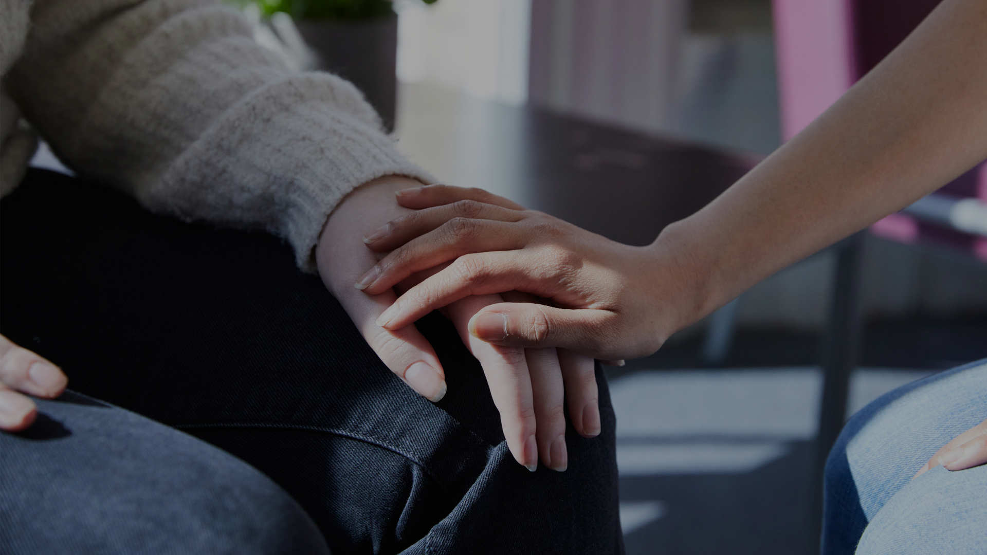 Clients holding hands in clinic