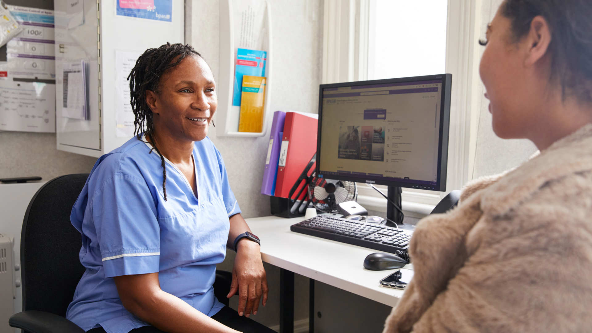 Nurse talking to client