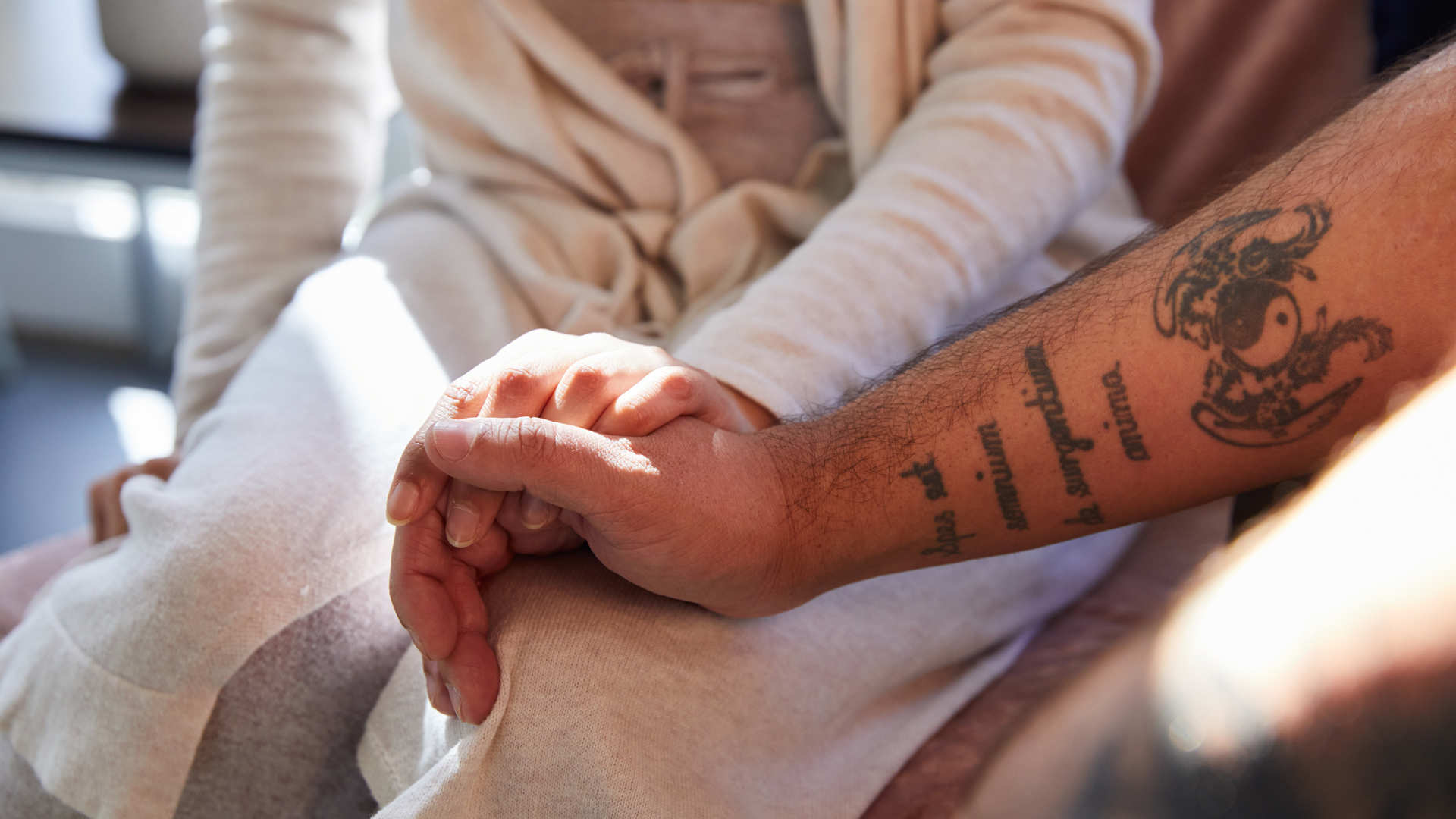 Clients holding hands in clinic