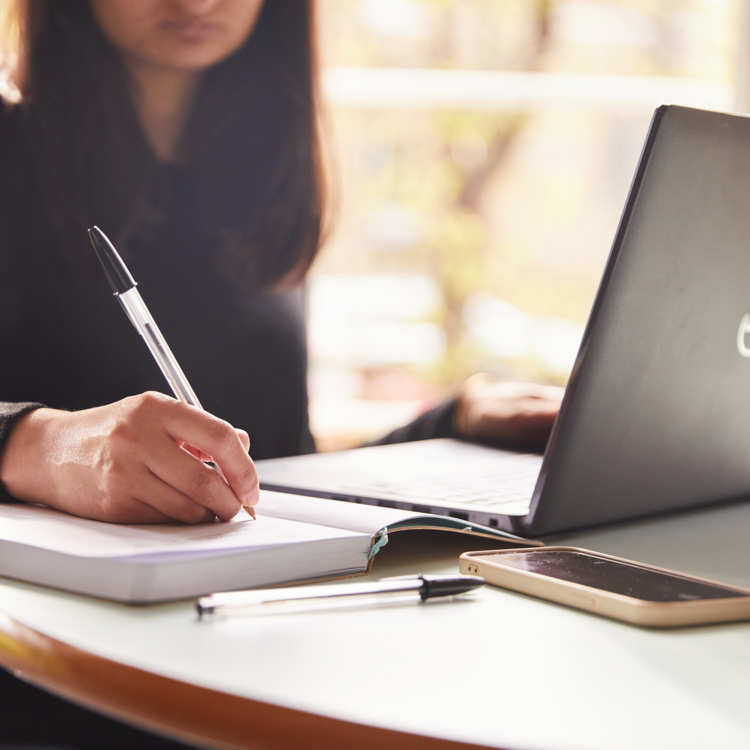 Person researching on laptop